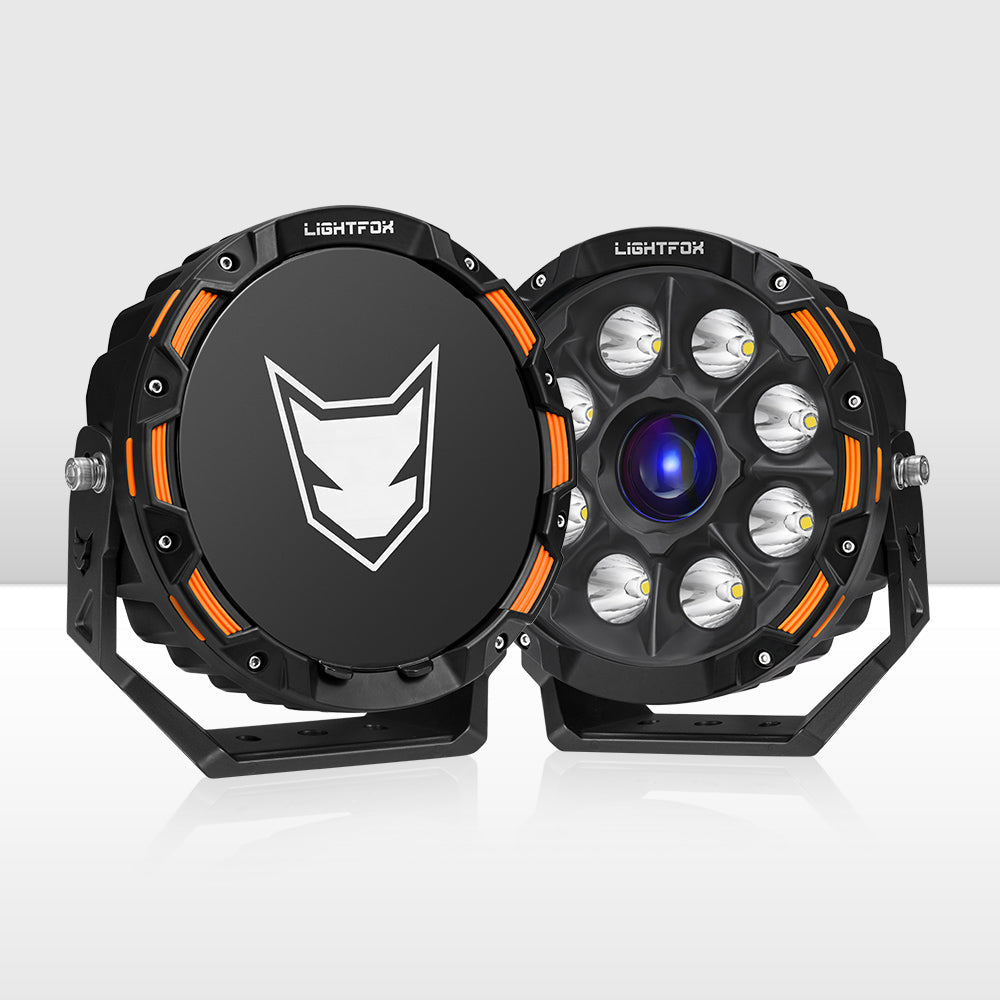 Two black and orange LED lights with a visible brand logo on a white background Two black and orange LED lights with a visible brand logo on a white background