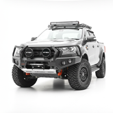 A grey Ford Ranger pickup truck bakkie with a heavy-duty black front bumper bull bar, dual round light bars, roof-mounted LED light bar, and off-road tires, photographed on a seamless white studio background.