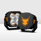 Black and orange off-road light with a prominent brand logo on a white background