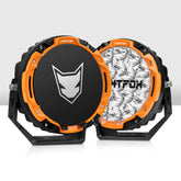 Two circular products with orange, black, and silver design on a white background