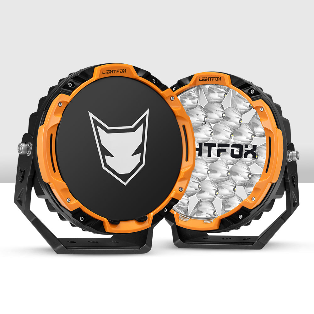 Two LED lights with orange and black design, featuring the Lightfox brand, on a white background. Two LED lights with orange and black design, featuring the Lightfox brand, on a white background.