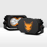 Black and orange off-road light with a prominent logo on a white background