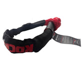 A black and red soft shackle for vehicle recovery, photographed on a solid white background.