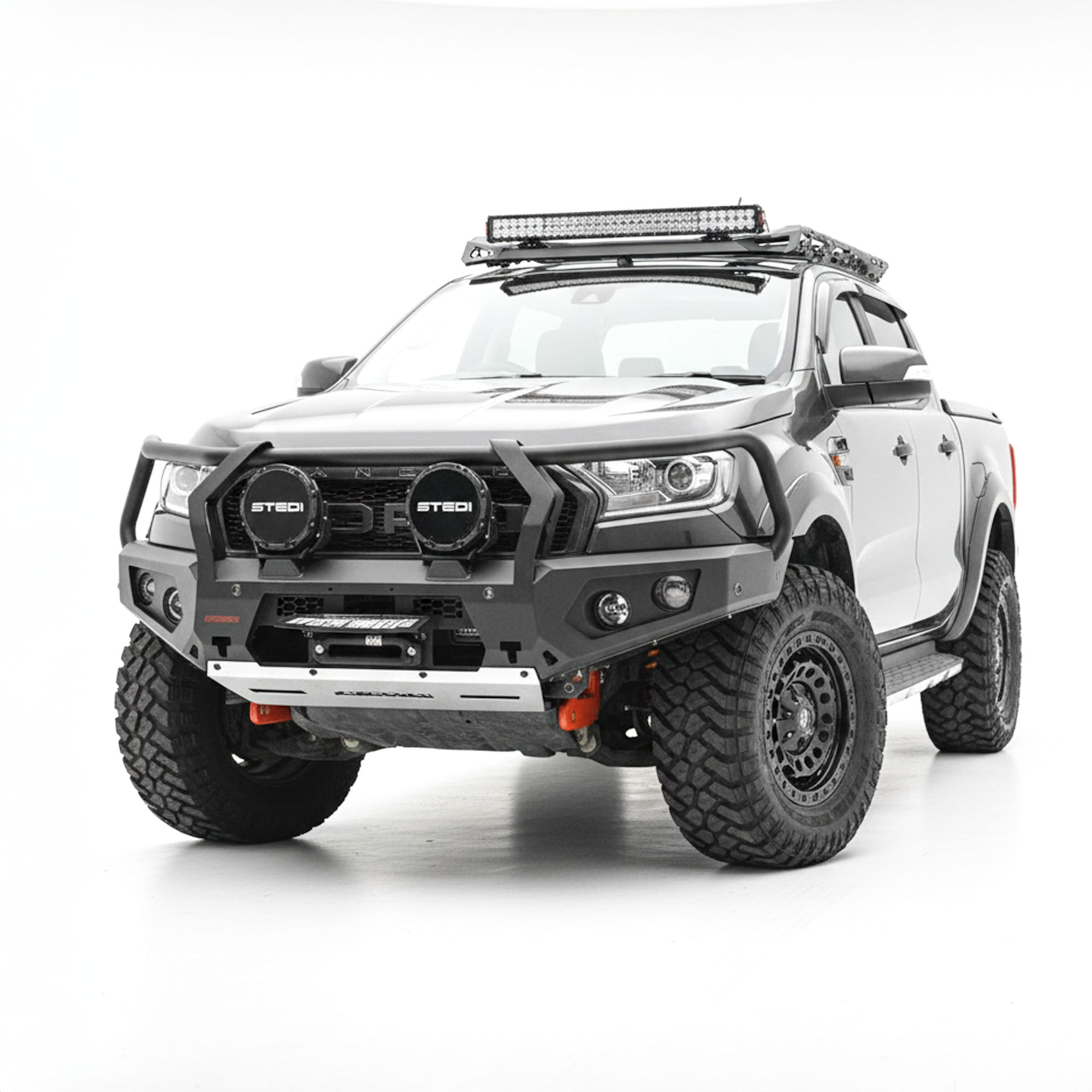 A grey Ford Ranger pickup truck bakkie with a heavy-duty black front bumper bull bar, dual round light bars, roof-mounted LED light bar, and off-road tires, photographed on a seamless white studio background.
