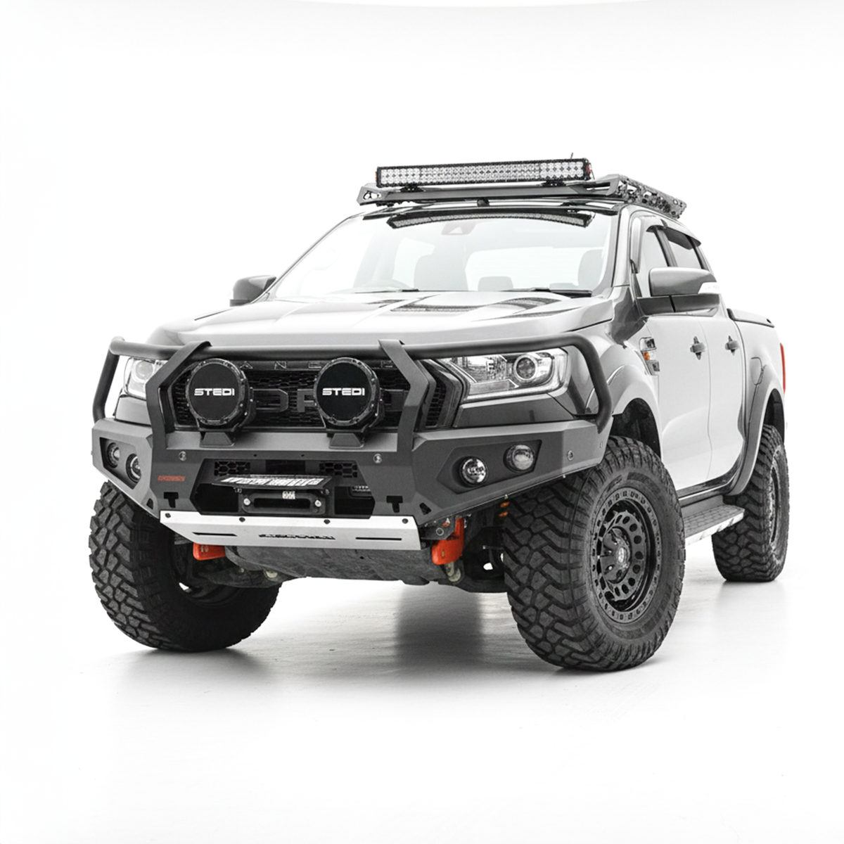 A grey Ford Ranger pickup truck bakkie with a heavy-duty black front bumper bull bar, dual round light bars, roof-mounted LED light bar, and off-road tires, photographed on a seamless white studio background.