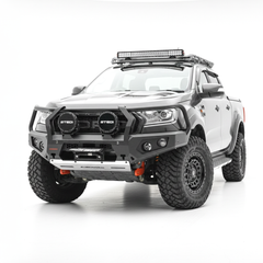 A grey Ford Ranger pickup truck bakkie with a heavy-duty black front bumper bull bar, dual round light bars, roof-mounted LED light bar, and off-road tires, photographed on a seamless white studio background.