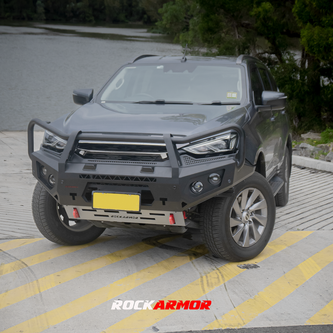 Gray Isuzu MU-X SUV with a Rockarmor front bumper bull bar on a paved surface.