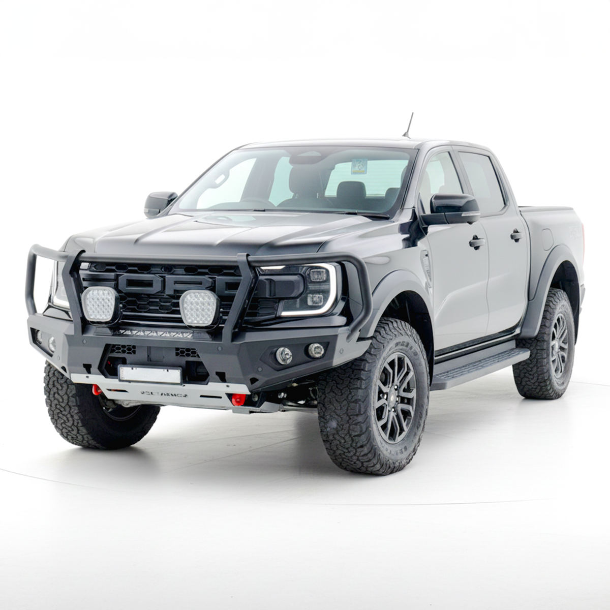 Gray Ford Ranger Raptor bakkie pickup truck with Rockarmor front bumper bull bar on a white background