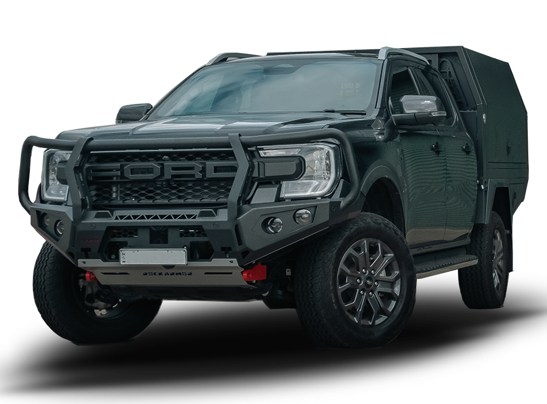 A dark grey Ford Ranger pickup truck bakkie with a custom Rockarmor black metal front bumper guard and a matching dark hardtop canopy, shown from a three-quarter front angle on a white background with a soft shadow.