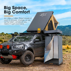 Portable roof top tent attached to a vehicle with portable camping shower and a scenic background