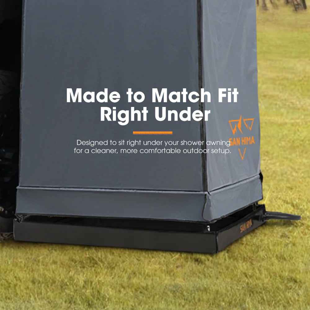 Outdoor shower enclosure with text 'Made to Match Fit Right Under' on a grassy background