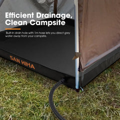 Camping mat with drain hole and hose attachment on grass, featuring San Hima branding