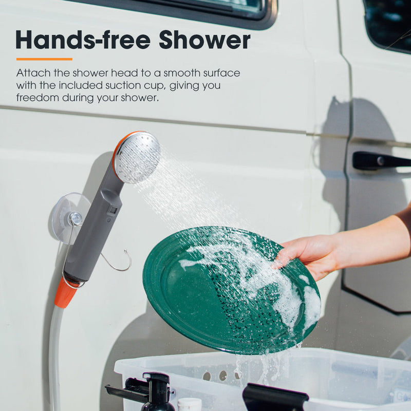 Hands-free shower system attached to a vehicle with a person using a green plate to collect water.