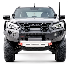 Isuzu vehicle with a front bumper bull bar and additional lights on a white background