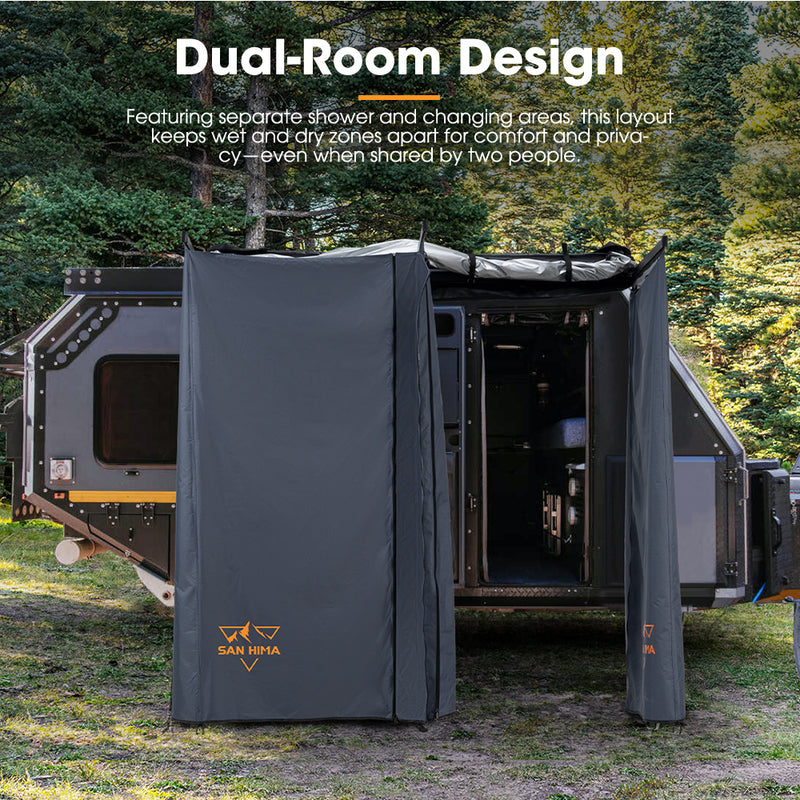 Camper with a dual-room design featuring separate San Hima shower and changing areas, set against a forest background.