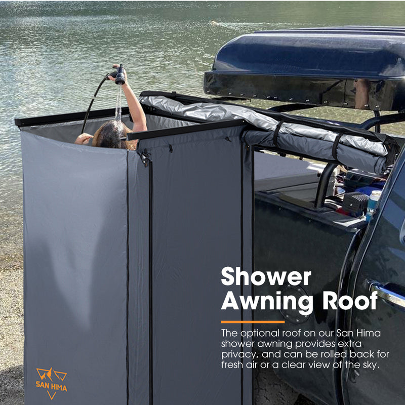 Shower awning roof attached to a vehicle by a body of water