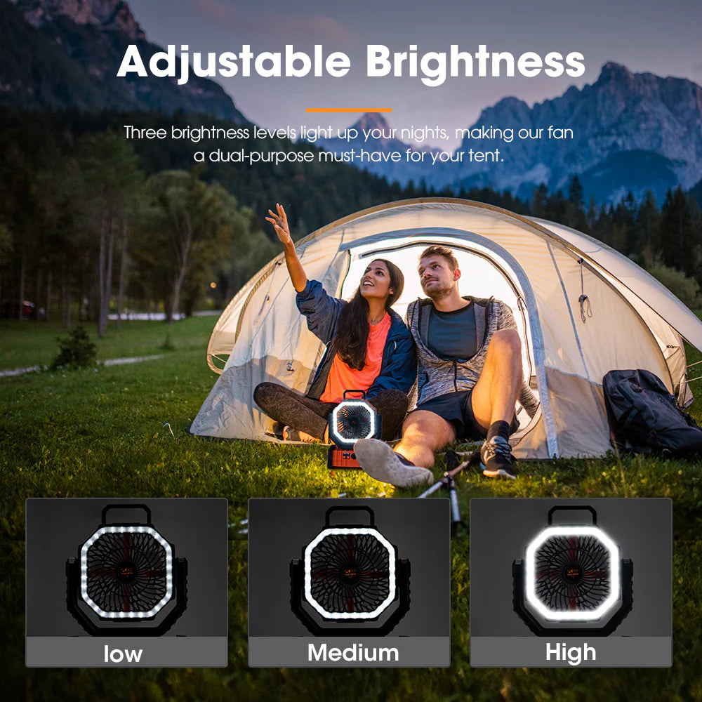 Two people sitting inside a tent with an adjustable brightness fan displayed below, set against a mountainous landscape.