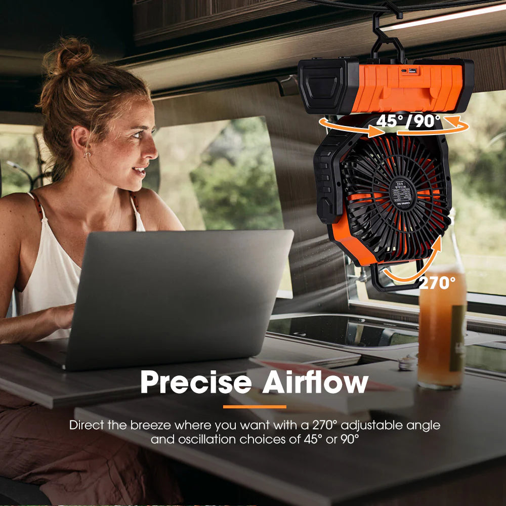 Woman using a laptop with a hanging fan in a vehicle, emphasising precise airflow.