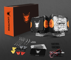 Lightfox off-road lights with packaging and accessories on a dark background