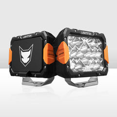 Two LED work lights with orange accents on a white background