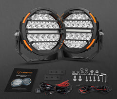 Pair of Lightfox LED driving lights with installation hardware on a dark background