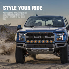 Blue Ford Ranger bakkie truck in a desert setting with protective light covers.