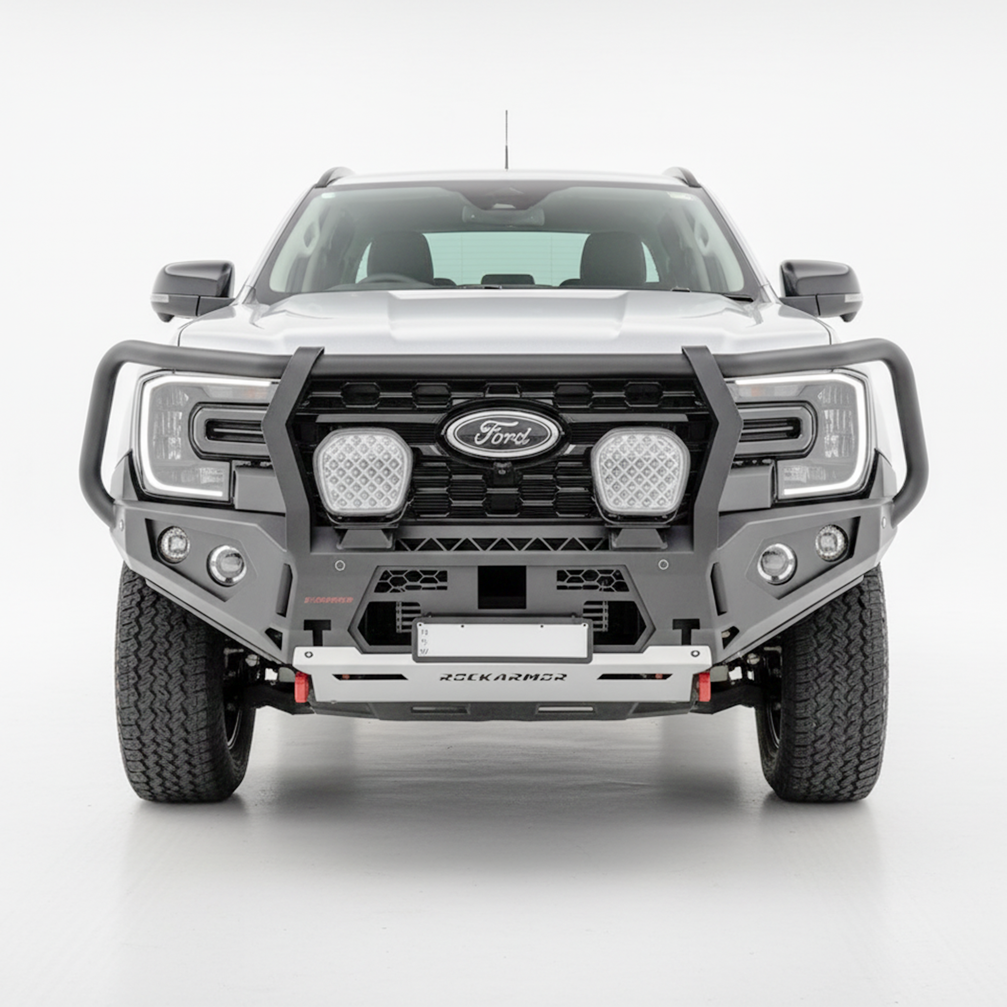 Grey Ford Everest SUV with a black grille and Rockarmor bumper bull bar on a white background