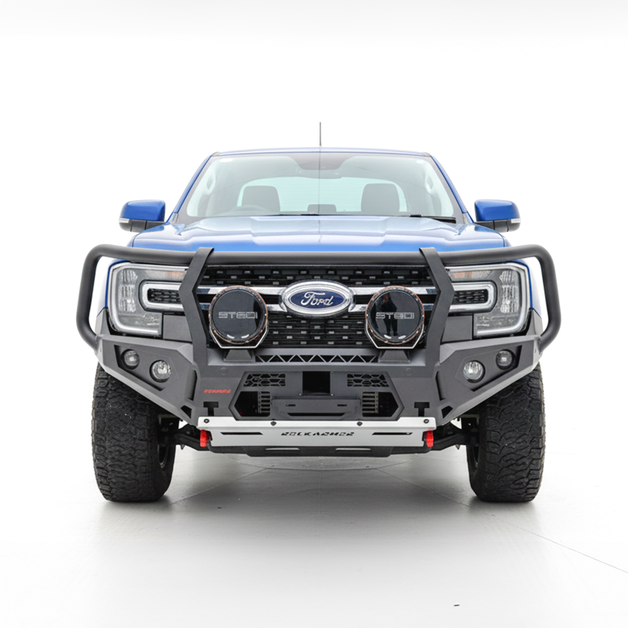 Front view of a blue Ford Ranger bakkie with a large Rockarmor bullbar on a white background
