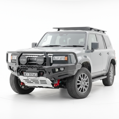 Silver Toyota Prado SUV with off-road bullbar, equipment on a white background