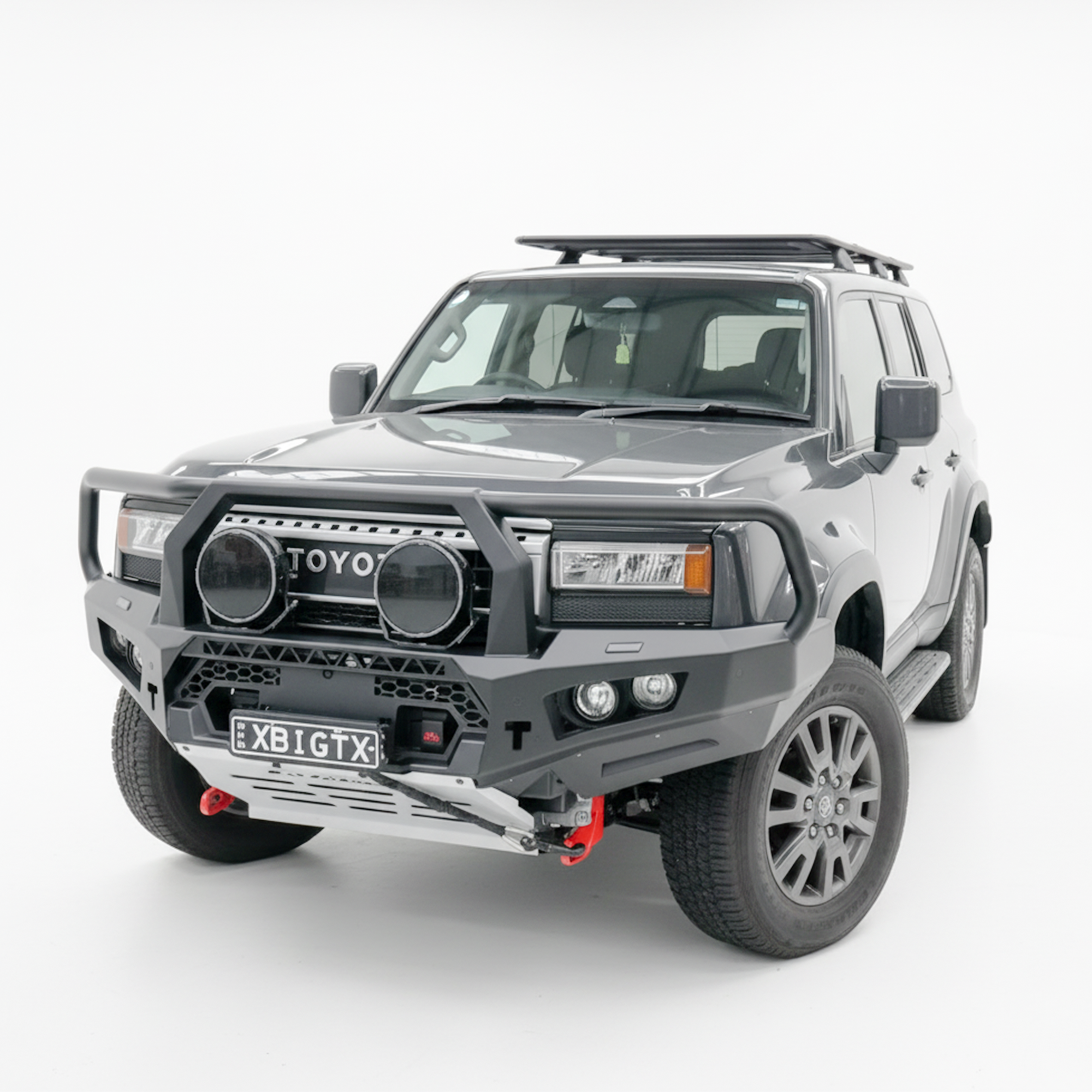 Gray SUV with Rockarmor bullbar bumper on a white background
