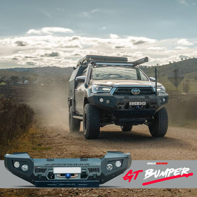 Toyota Hilux driving down a country gravel road with a Rockarmor GT bullbar bumper in the foreground.