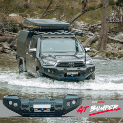 Toyota Hilux crossing a river with a Rockarmor GT bullbar bumper in the foreground.