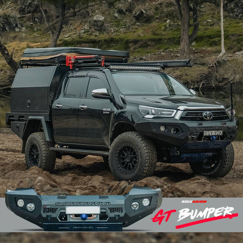 Toyota Hilux parked in sand with a Rockarmor GT bullbar bumper in the foreground.