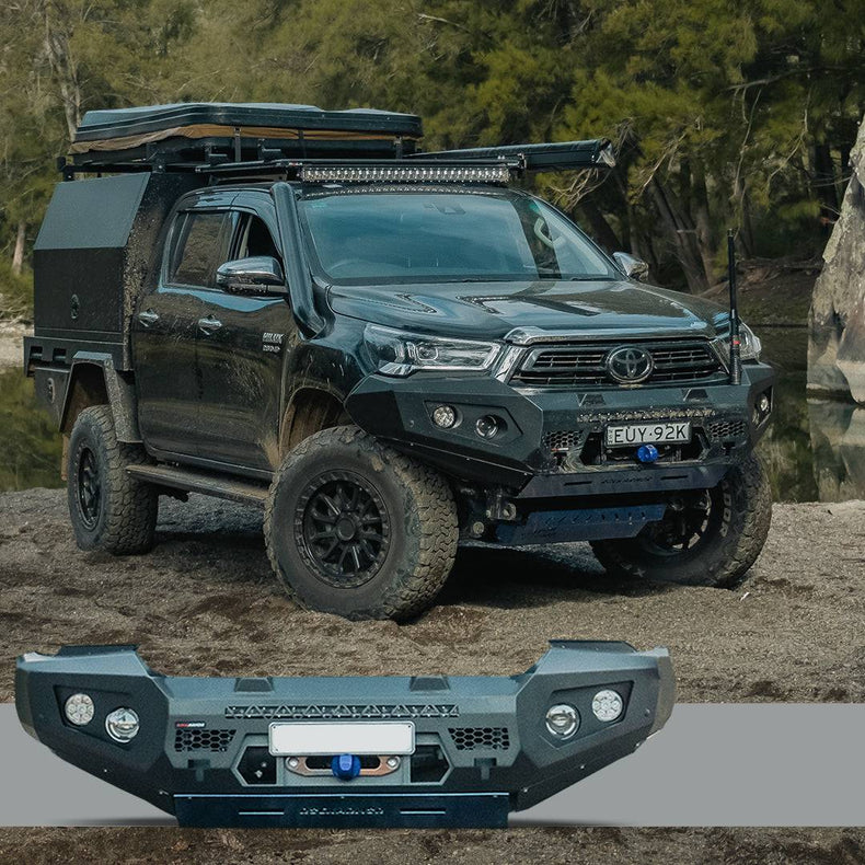 Toyota Hilux parked in sand with a Rockarmor GT bullbar bumper in the foreground.