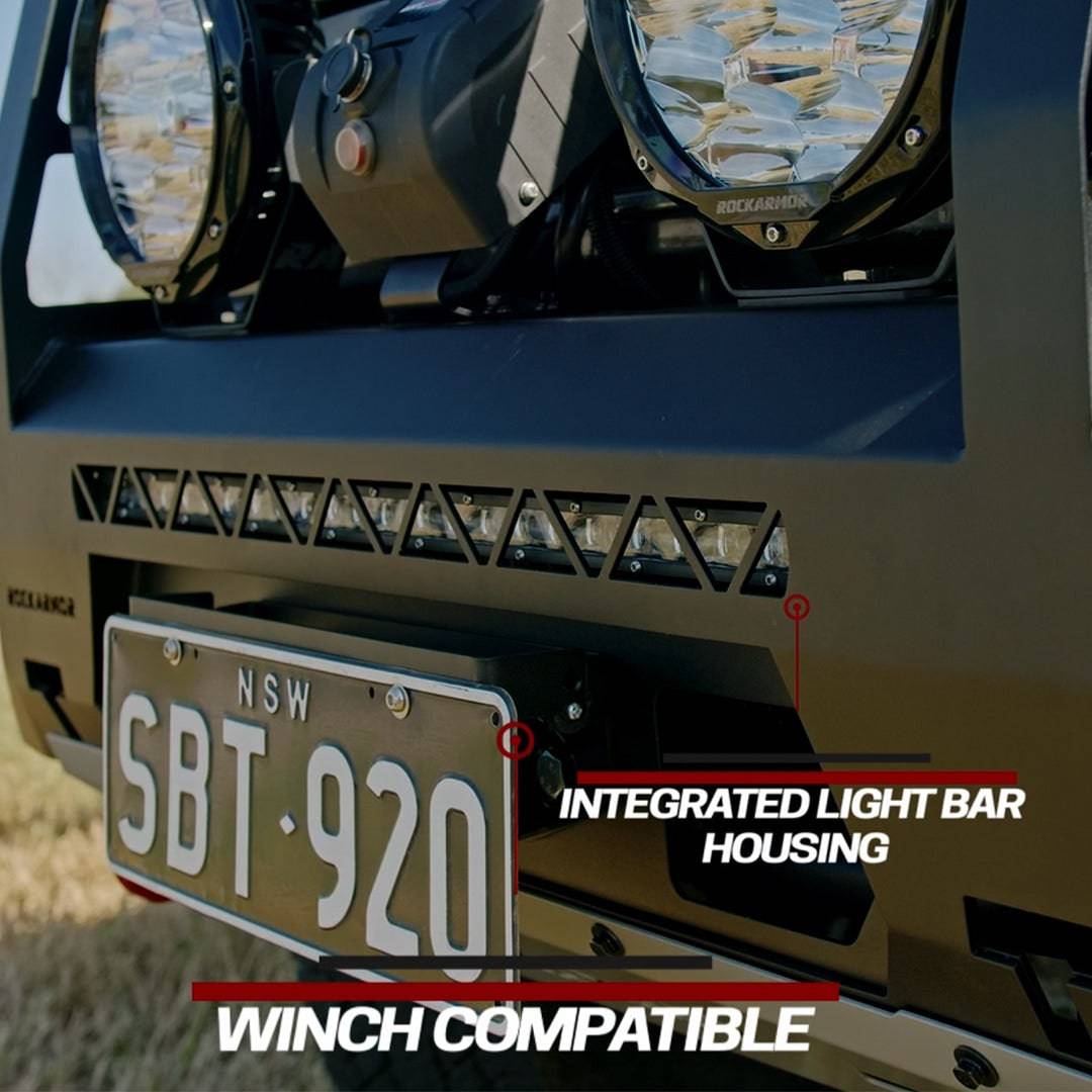 Front view of a vehicle with integrated light bar housing and winch compatibility text.