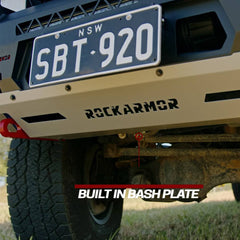 Close-up of a vehicle bash plate with 'Rockarmor' branding and a license plate.