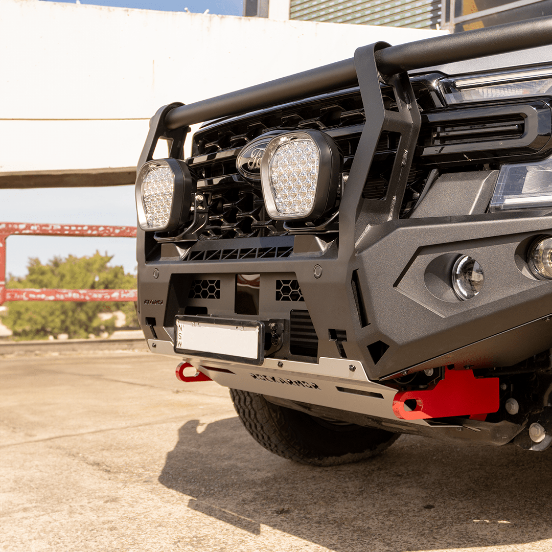 Close-up of a Ford Everest Rockarmor front bumper bull bar with additional lights