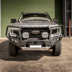 Grey Ford Everest SUV with a black grille and Rockarmor bumper bull bar