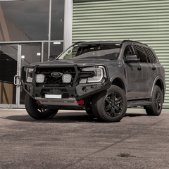 Grey Ford Everest SUV with a black grille and Rockarmor bumper bull bar