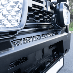 Close-up of a Ford Ranger Raptor Rockarmor branded front bull bar with additional lights