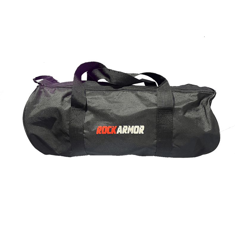 A black cylindrical duffel bag with black handles, featuring the 'ROCKARMOR' logo printed on the front in red, white, and black. The bag is photographed against a solid white background.