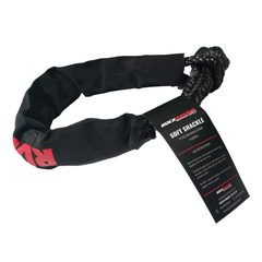 A black nylon soft shackle with a black braided rope end and a black hangtag, photographed on a clean white background. The tag shows the brand ROCKARMOR and the text SOFT SHACKLE.