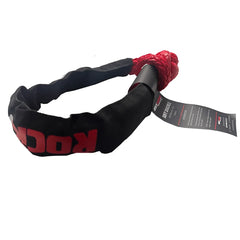 A black and red soft shackle for vehicle recovery, photographed on a solid white background.