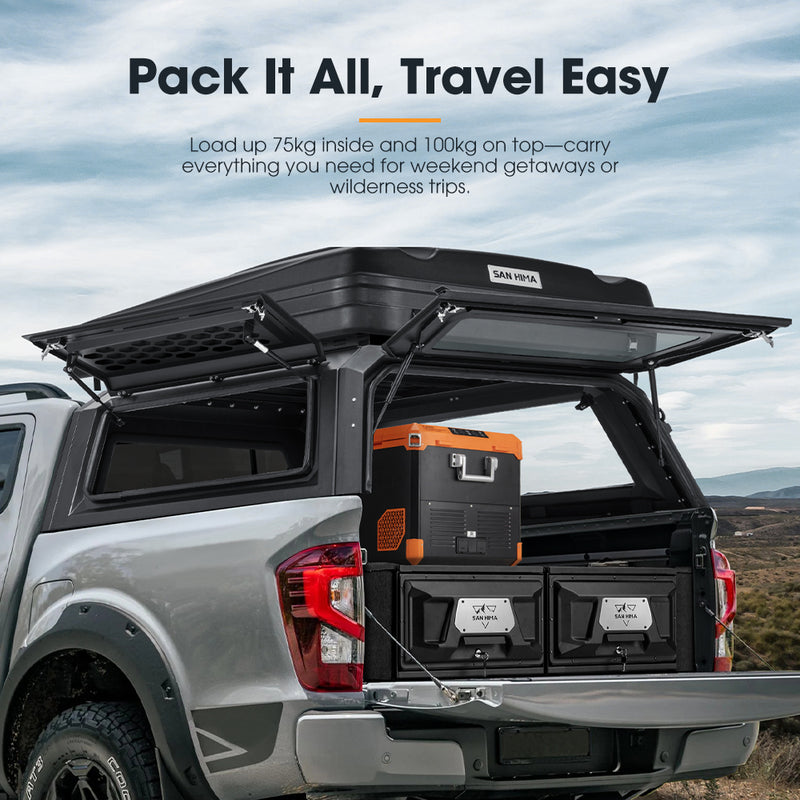 Truck bed with open cargo area and storage boxes, featuring text about load capacity and travel ease.
