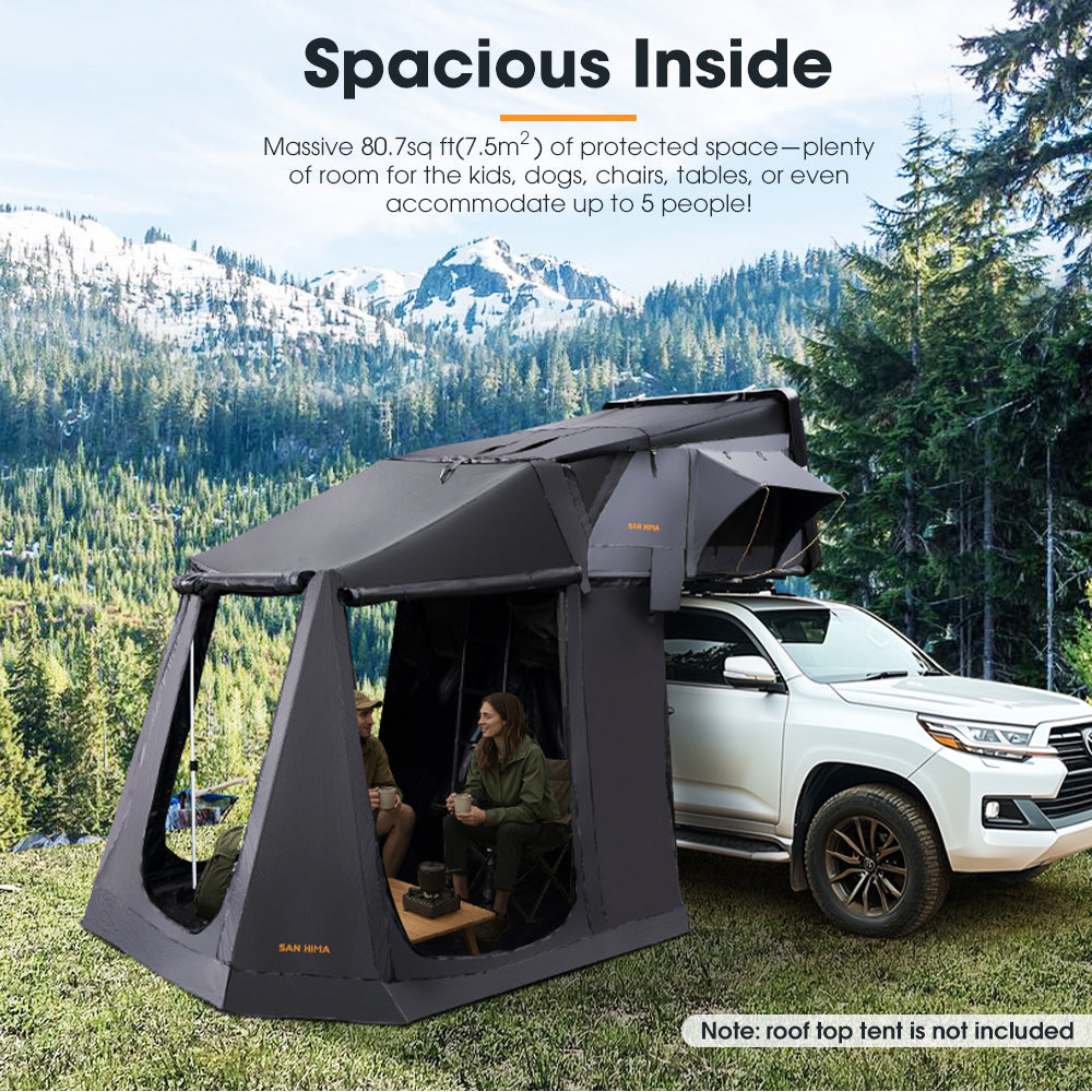 Black San Hima Jervis Rooftop Tent, and Annex Camping Shade with people inside, set against a mountainous landscape.