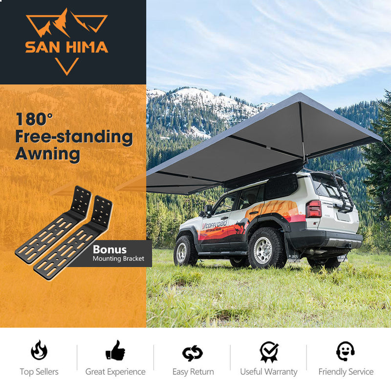 San Hima 180° Free-standing Awning with bonus mounting bracket on a vehicle in a mountainous area.