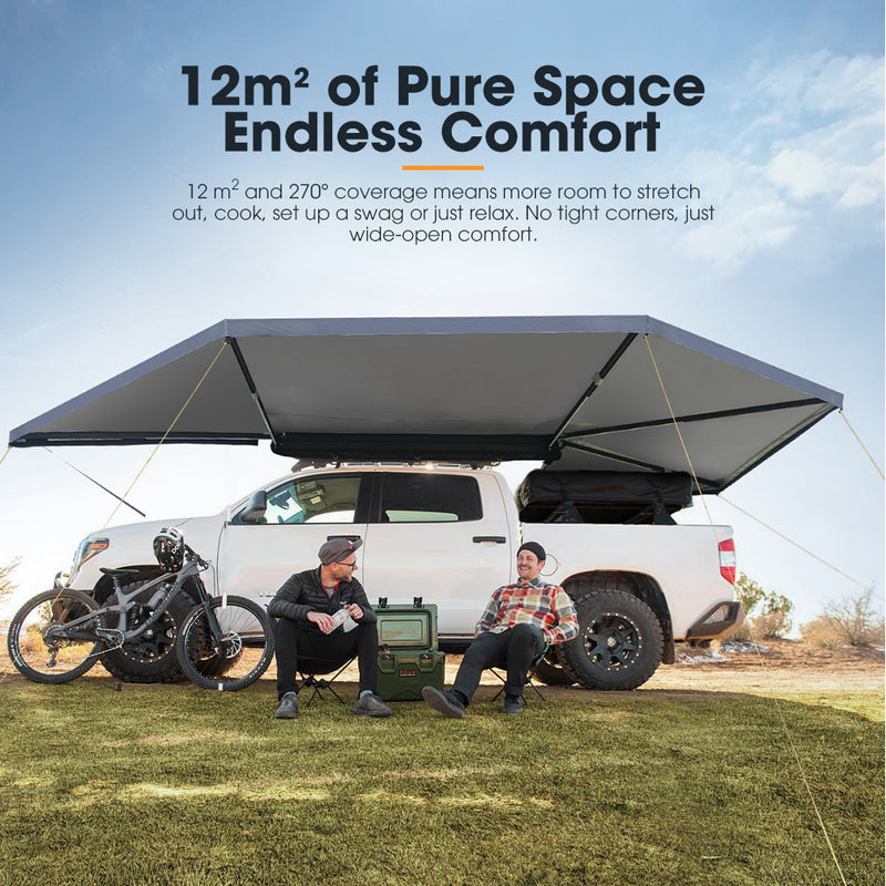 Two people sitting under a large truck awning with text about space and comfort.