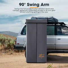 90-degree camping shower swing arm attached to a vehicle in a desert setting with text describing its function.