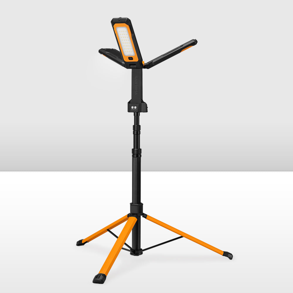Orange and black adjustable LED camping light stand on a white background