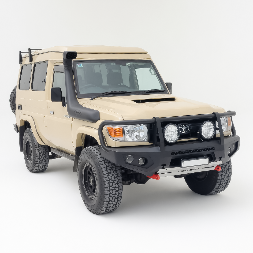 Beige Toyota SUV with black bull bar on a white background
